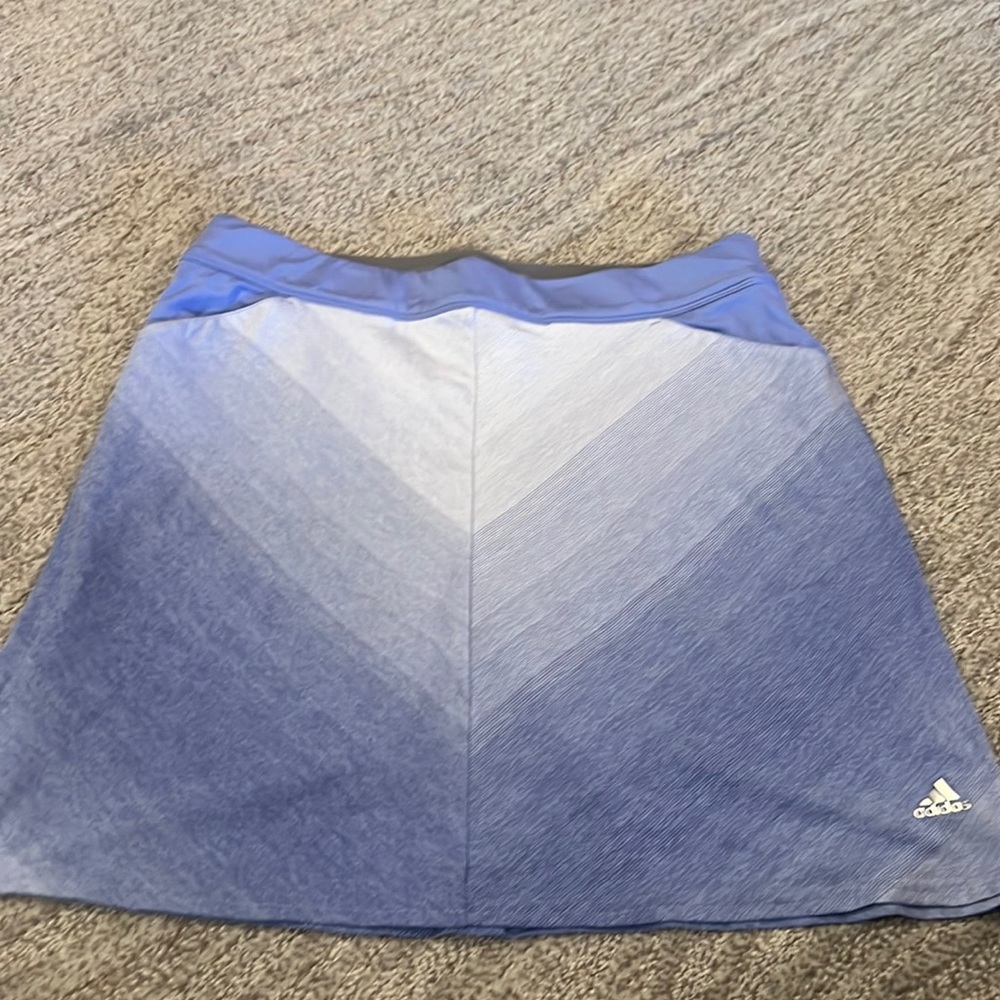 Golf skirt. Adidas. Attached shorts. Pockets. Excellent condition.Cotton.Size S